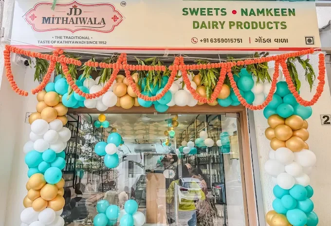 JD Mithaiwala shop entrance decorated with flowers and colourful balloons
